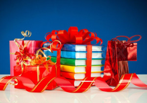 3183396-christmas-presents-with-stack-of-books-against-blue-background
